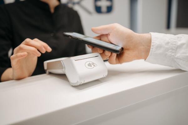 a person making payment using smartphone